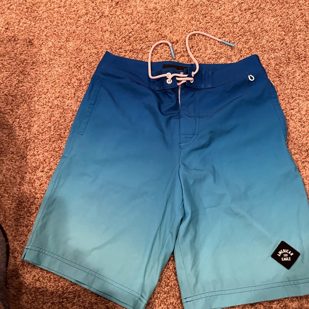 American Eagle men’s board shorts.  Color blue ombré.  Size small.